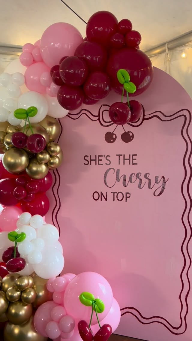 Cherry themed pink balloon backdrop by Lovely Pop Luxury Events