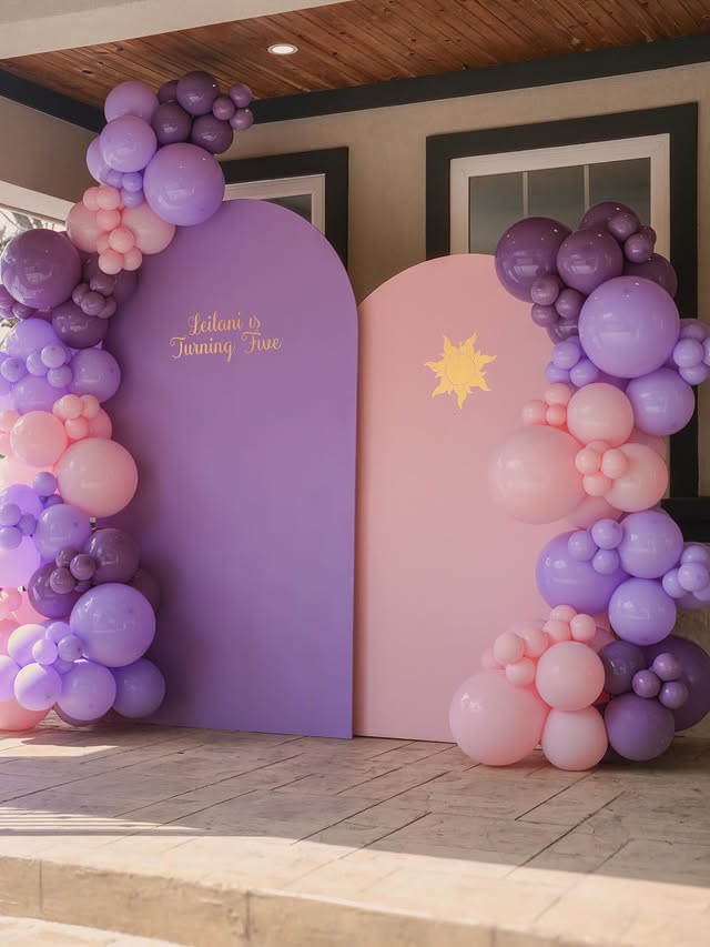 Custom purple balloon arch installation by Lovely Pop Luxury Events